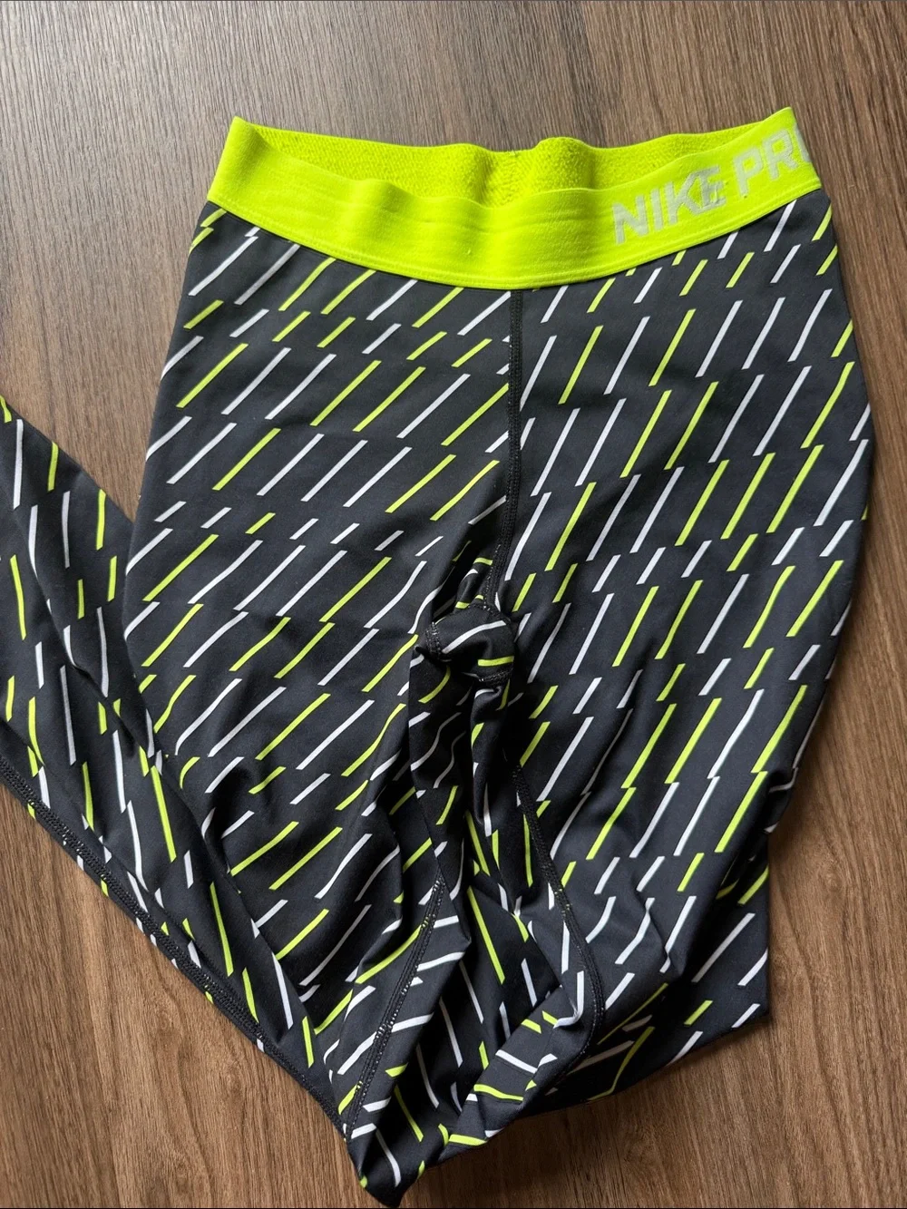 Nike Black Leggings with Neon Yellow and White Dash Pattern